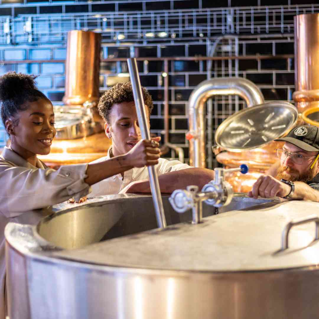 People brewing beer at Brewhouse and Kitchen