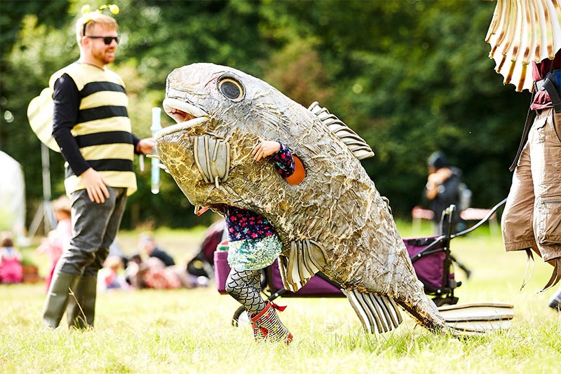Child in a fish costume at Just So Festival
